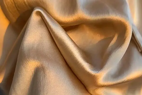 Silk satin sheen on sleep products and apparel