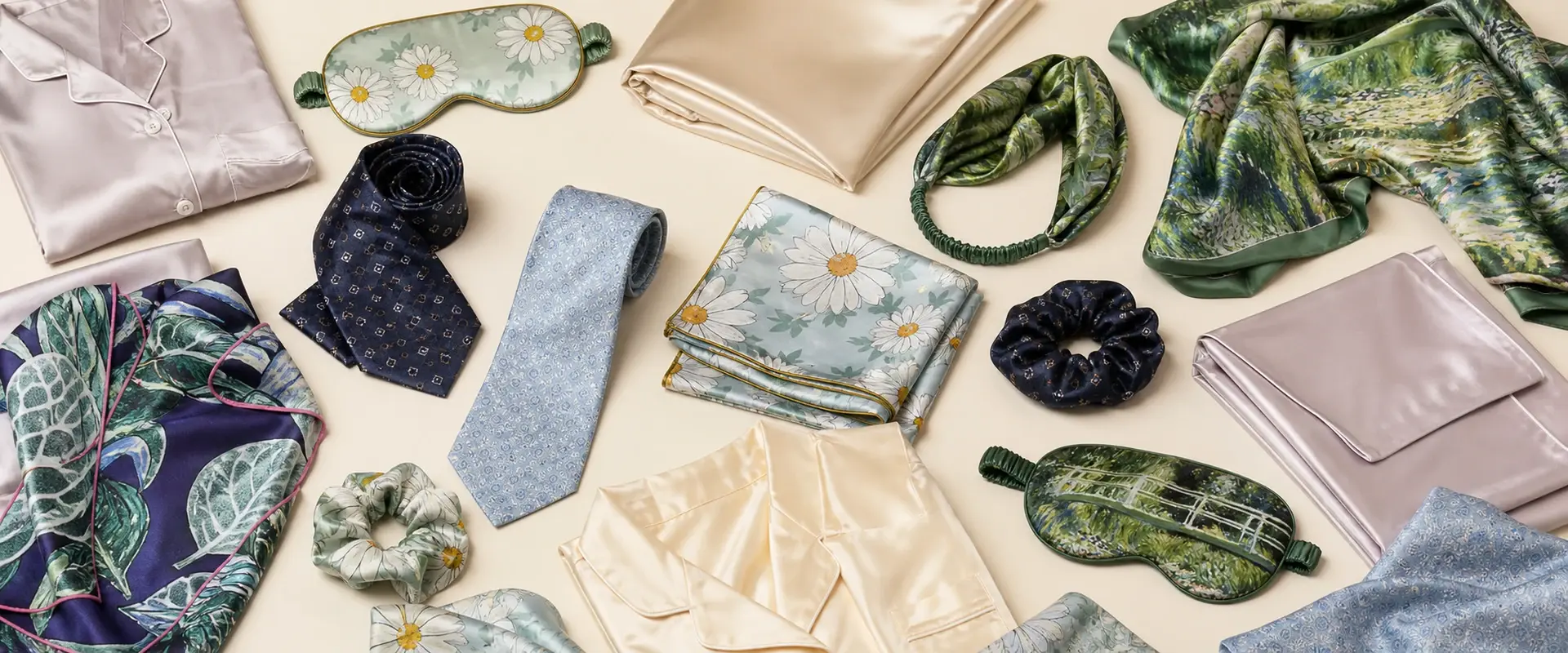 Assorted silk scarves, ties, sleep accessories, pillowcases and pajamas arranged together
