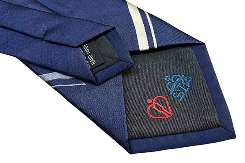Tie back seam keeper labels and packaging