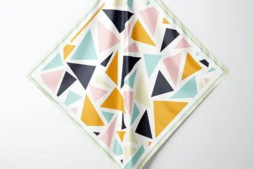 Geometric print square scarf folded on a white background