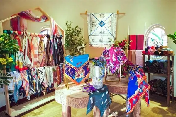 Assorted printed scarves displayed as a colorful retail collection