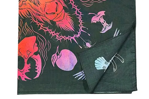 Folded artist-print scarf showing contrasting artwork and machine-finished edges