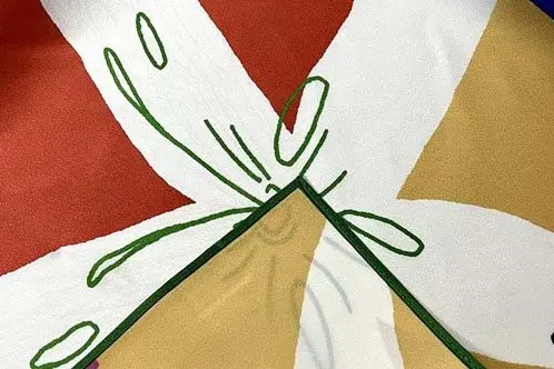 Printed silk satin scarf close-up showing smooth surface sheen