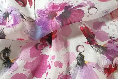 Floral printed silk chiffon showing color through layered folds
