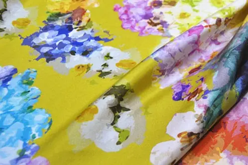 Printed silk twill folded to show its color, body and structured surface