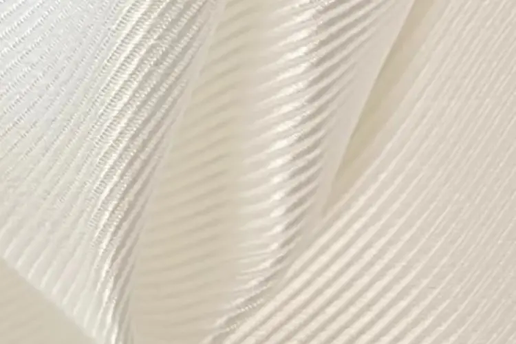 Close view of silk twill showing its diagonal weave and structured folds