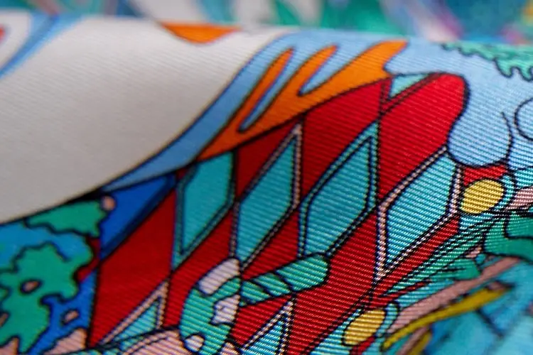 Printed silk twill showing diagonal weave lines across the artwork