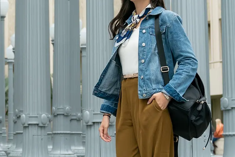 Small printed silk scarf tied at the neck as a wearable retail accessory