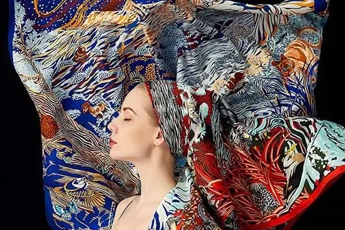 Model framed by printed silk twill scarves in several artwork directions