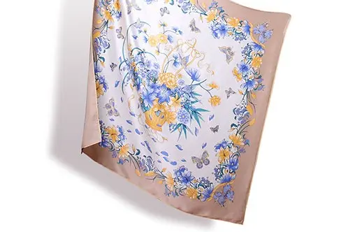 Square floral silk scarf displayed to review the border, corners and central artwork