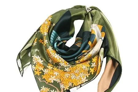 Square printed scarf folded and tied at the neck
