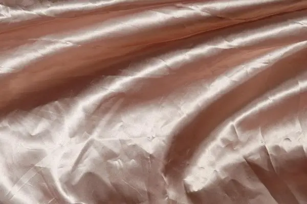 Creases in silk fabric and folded packaging