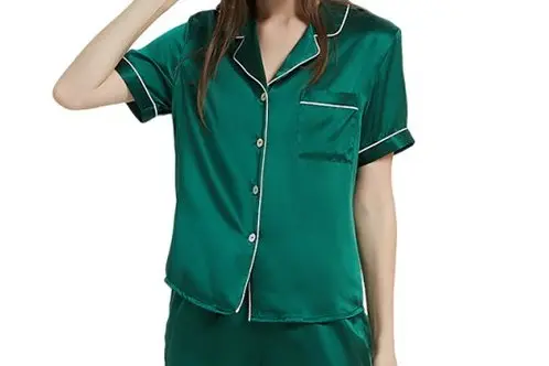 Green silk pajama top showing contrast piping, buttons, collar and sleeve finish